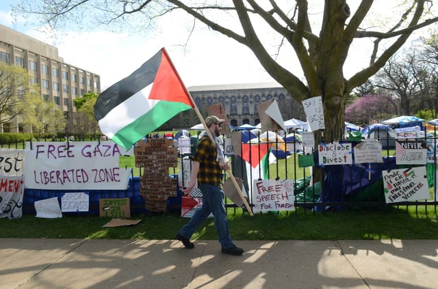 Banners hanging from the fence outside Northwestern University during a pro-Palestinian protest, Evanston, Illinois, April 27, 2024. (Jacek Boczarski/Anadolu via Getty Images)