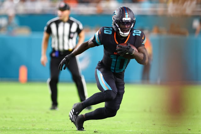 MIAMI GARDENS, FLORIDA - SEPTEMBER 29: Tyreek Hill #10 of the Miami Dolphins carries the ball after a reception against the New York Jets during the second quarter of the game at Hard Rock Stadium on September 29, 2025 in Miami Gardens, Florida. (Photo by Megan Briggs/Getty Images)