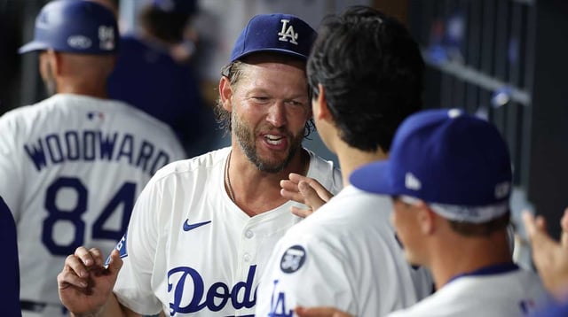 Sep 19, 2025; Los Angeles, California, USA; Los Angeles Dodgers pitcher Clayton Kershaw (22) is greeted by designated hitter Shohei Ohtani (17) after being relieved during the fifth inning against the San Francisco Giants at Dodger Stadium. Mandatory Credit: Kiyoshi Mio-Imagn Images