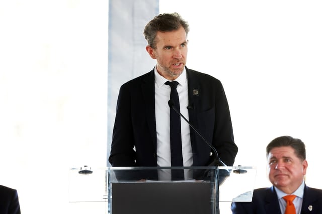 Jeremy O'Brien, of PsiQuantum, speaks during a groundbreaking ceremony for the Illinois Quantum and Microelectronics Park at Lake Michigan south of East 87th Street in Chicago on Sept. 30, 2025. Gov. JB Pritzker, right, attended. (Terrence Antonio James/Chicago Tribune)