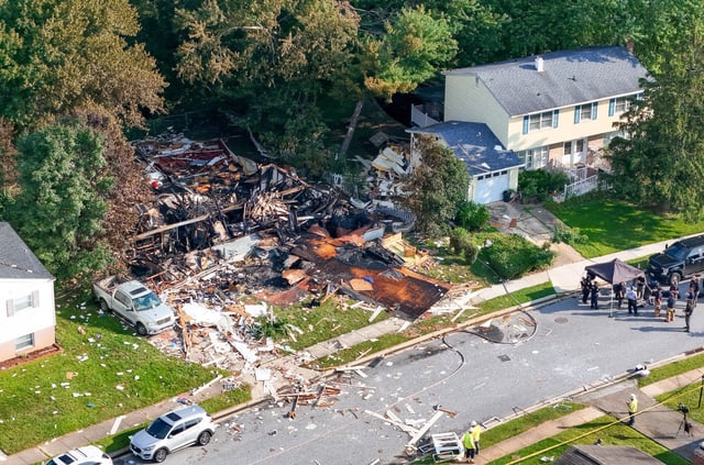 BGE workers on the scene of a home explosion in the 8100 block of Callo Lane in Rosedale, Md. (Kevin Richardson/Staff)