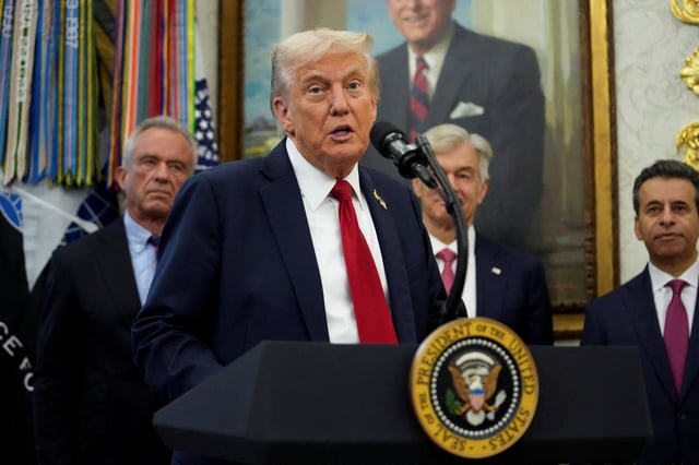 U.S. President Donald Trump announces a deal with Pfizer to sell drugs at lower prices, in the Oval office of the White House in Washington, D.C., U.S., September 30, 2025. REUTERS/Ken Cedeno