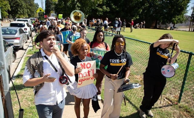 People march in Memphis, Tenn., Saturday, Sept. 27, 2025, to protest against the deployment of National Guard troops to Memphis.