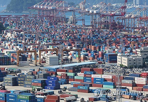 In this file photo taken July 31, 2025, containers wait to be shipped at a port in Busan, about 330 kilometers southeast of Seoul. (Yonhap)