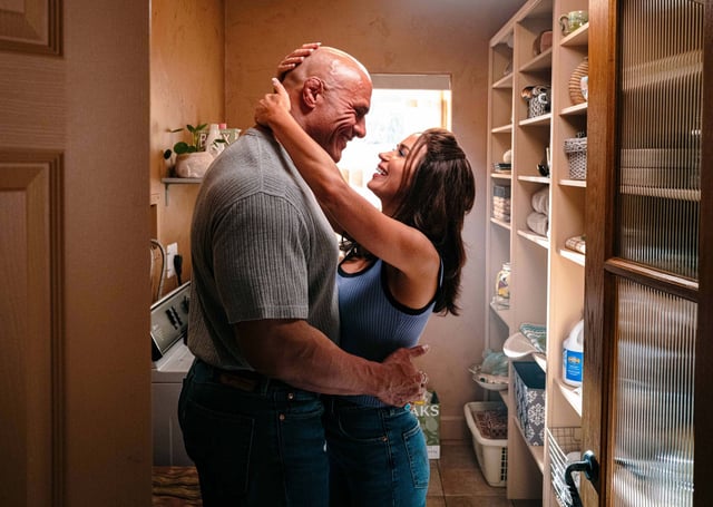 Emily Blunt, right, and Dwayne Johnson in a scene from “The Smashing Machine.”