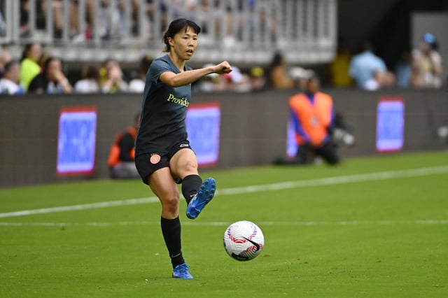 Sep 7, 2024; Washington, District of Columbia, USA; Portland Thorns FC midfielder Hina Sugita (8) kicks the ball against the Washington Spirit during the second half at Audi Field. Mandatory Credit: Brad Mills-Imagn Images/File Photo