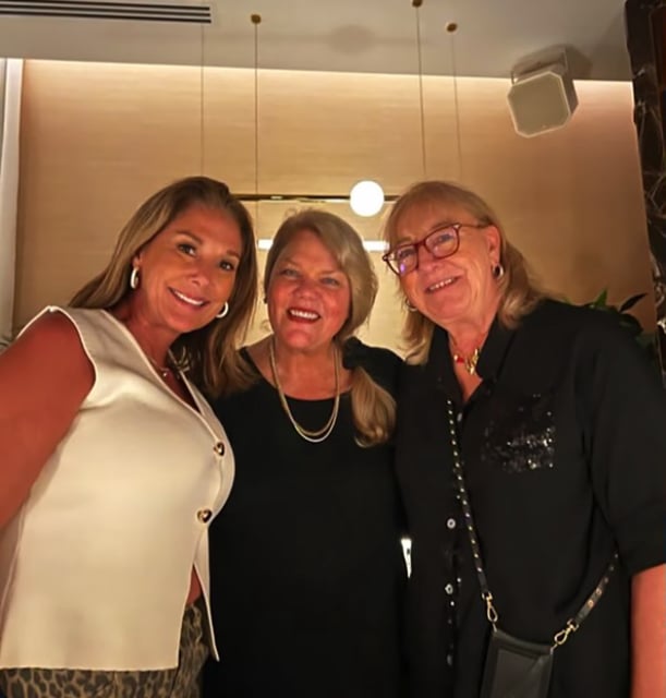 Randi Mahomes, Andrea Swift and Donna Kelce posing together for a pic. 