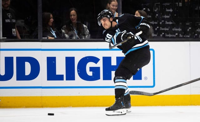 Utah Hockey Club’s Sean Durzi (50) takes a shot during an NHL game between the Utah Hockey Club and the Los Angeles Kings at the Delta Center in Salt Lake City on Thursday, April 3, 2025.