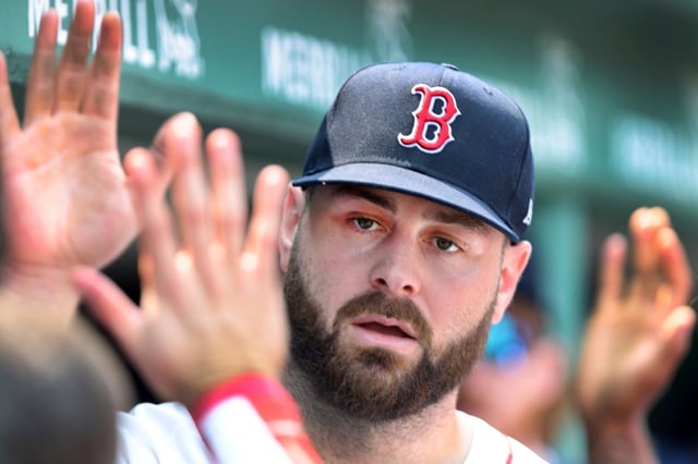 Boston Red Sox starting pitcher Lucas Giolito gets high fives in the dugout after the top of the eighth inning during a baseball game against the Houton Astros, Sunday, August 3, 2025, in Boston (AP Photo/Jim Davis).