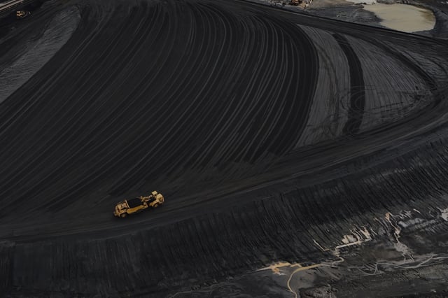 FILE - Heavy equipment moves through coal at the Gen. James Gavin Power Plant, a coal-fired power plant, April 14, 2025, in Cheshire, Ohio. (AP Photo/Joshua A. Bickel, File)
