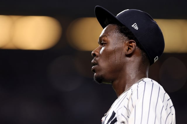 NEW YORK, NEW YORK - AUGUST 12:  Jazz Chisholm Jr. #13 of the New York Yankees heads back to the dugout at the end of the inning against the Minnesota Twins at Yankee Stadium on August 12, 2025 in the Bronx borough of New York City. (Photo by Elsa/Getty Images)