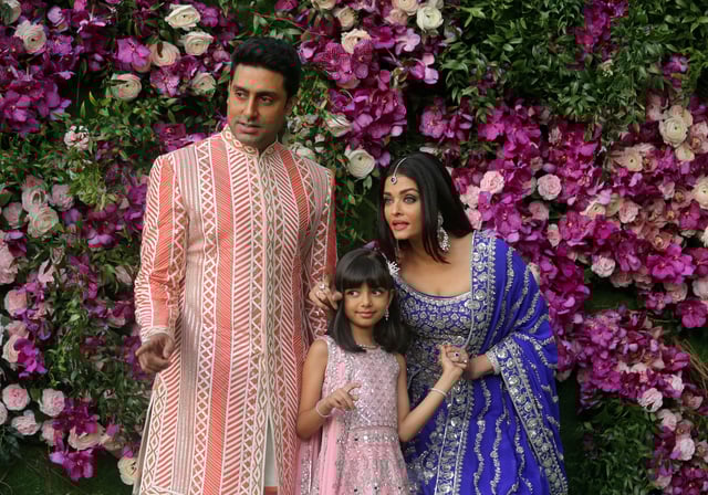 Actor Abhishek Bachchan, his wife actress Aishwarya Rai and their daughter Aaradhya pose during a photo opportunity at Bandra-Kurla Complex in Mumbai, India, March 9, 2019. REUTERS/Francis Mascarenhas/File Photo