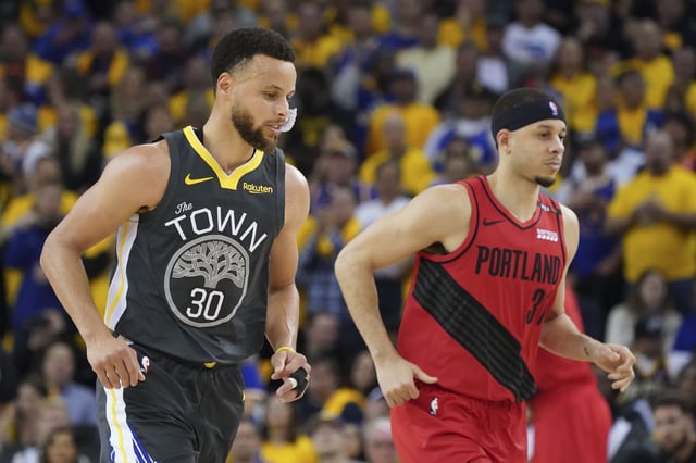 May 16, 2019; Oakland, CA, USA; Golden State Warriors guard Stephen Curry (30) and Portland Trail Blazers guard Seth Curry (31) jog during the third quarter in game two of the Western conference finals of the 2019 NBA Playoffs at Oracle Arena. Mandatory Credit: Kyle Terada-USA TODAY Sports
