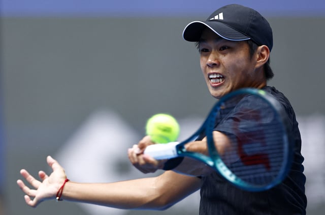 Tennis - China Open - The Beijing Olympic Green Tennis Center, Beijing, China - October 1, 2025 Learner Tien of the U.S. in action during his final against Italy's Jannik Sinner REUTERS/Tingshu Wang