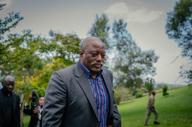 Former President of the Democratic Republic of Congo Joseph Kabila walks back into his house after posing for a group photo with religious leaders at one of his residences in Goma on May 29, 2025.