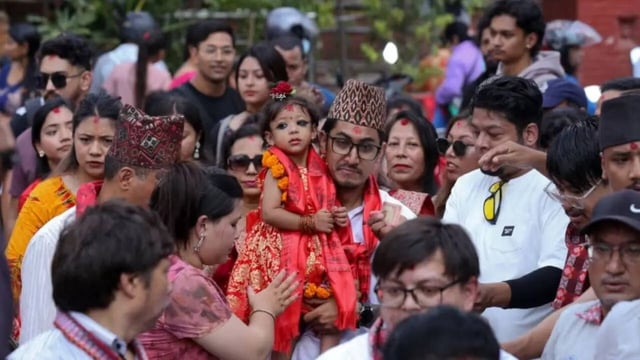 Aryatara Shakya is carried by her father as she is brought to the Taleju Bhawani Temple in Kathmandu Durbar Square, Nepal. Subaas Shrestha/Nur Photo/Associated Press)