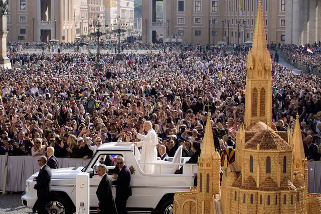 Pope Leo XIV waves as he arrives for his weekly general audience in St. Peter's Square at The Vatican, Wednesday, Oct.1, 2025. (AP Photo/Gregorio Borgia)