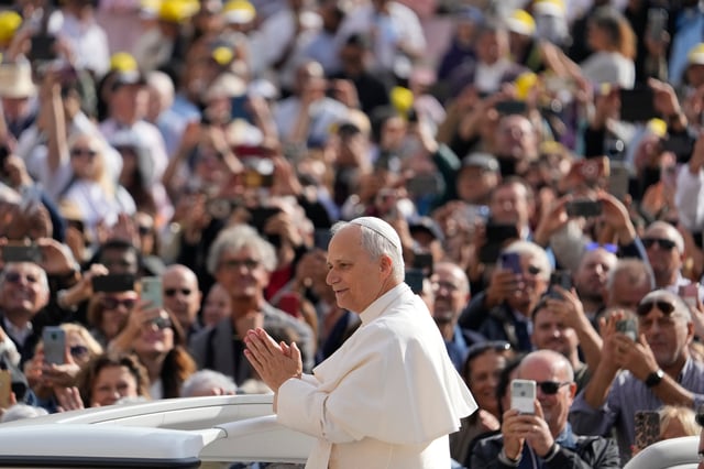 Pope Leo XIV gestures as he arrives for his weekly general audience in St. Peter's Square at The Vatican, Wednesday, Oct.1, 2025. (AP Photo/Gregorio Borgia)