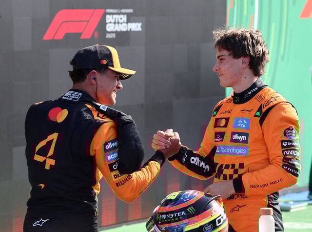 Formula One F1 - Dutch Grand Prix - Circuit Zandvoort, Zandvoort, Netherlands - August 30, 2025 McLaren's Oscar Piastri celebrates after qualifying in pole position with second placed McLaren's Lando Norris REUTERS/Jakub Porzycki