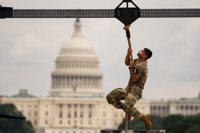 People attend a festival marking the 250th anniversary of the U.S. Army on the National Mall in Washington, D.C., before the military parade on June 14, 2025.