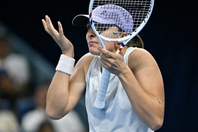 Iga Swiatek reacts during her match against USA’s Emma Navarro