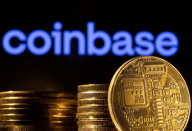 A representation of the cryptocurrency is seen in front of Coinbase logo in this illustration taken, March 4, 2022. REUTERS/Dado Ruvic/Illustration/File Photo