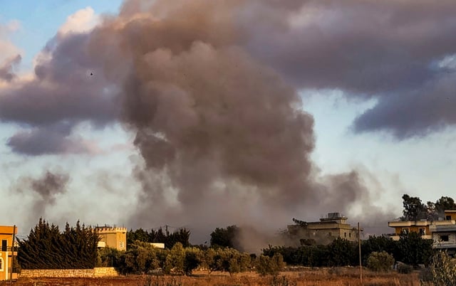 Smoke billows over Kfar Tebnit after an Israeli strike near Lebanon’s border with Israel, in Lebanon, September 18, 2025. REUTERS/Ali Hankir