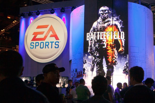 FILE - Attendees line up at the Electronic Arts booth to play the Battlefield 3 video game at the Electronic Entertainment Expo in Los Angeles on June 8, 2011. (AP Photo/Damian Dovarganes, File)