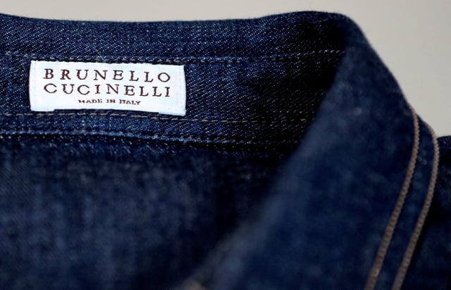 A Brunello Cucinelli label is seen on a shirt at the factory in Solomeo village near Perugia, Italy, September 4, 2018.   REUTERS/Alessandro Bianchi/File Photo