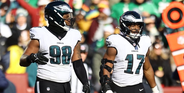LANDOVER, MARYLAND - DECEMBER 22: Jalen Carter #98 and Nakobe Dean #17 of the Philadelphia Eagles look on against the Washington Commanders at Northwest Stadium on December 22, 2024 in Landover, Maryland. (Photo by Timothy Nwachukwu/Getty Images)