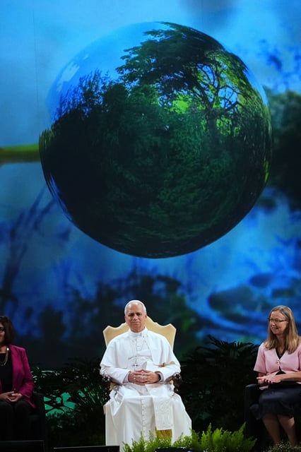 Pope Leo XIV, center, attends the International conference "Raising Hope for Climate Justice", in Castel Gandolfo, Italy, Wednesday, Oct. 1, 2025. (AP Photo/Alessandra Tarantino)