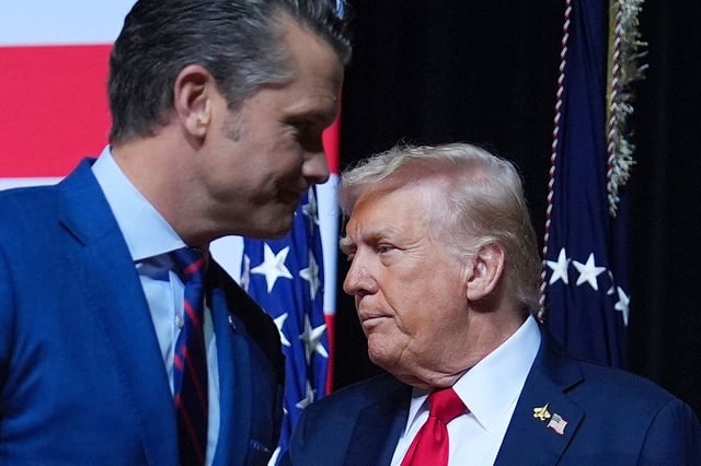 President Donald Trump is greeted by Secretary of Defense Pete Hegseth, before speaking to a gathering of top military commanders at Marine Corps Base Quantico, on Tuesday.