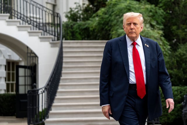 President Donald Trump walks to speak with reporters outside the White House on Tuesday.