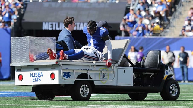 Sep 28, 2025; East Rutherford, New Jersey, USA; New York Giants wide receiver Malik Nabers (1) is carted off the field following an injury during the second quarter against the Los Angeles Chargers at MetLife Stadium. Mandatory Credit: Brad Penner-Imagn Images