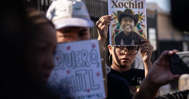 Protesters hold signs up during a rally for the release of Catalina “Xochitl” Santiago, a DACA recipient who was detained by immigration agents at El Paso International Airport in August, outside of the El Paso Service Processing Center, an immigration detention center in El Paso on Wednesday, Sept. 10, 2025.