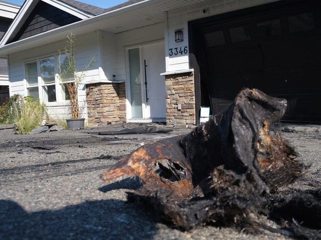  Remains of a burnt out vehicle outside the home of Punjabi musician AP Dhillon in Colwood, Sept. 2, 2024.