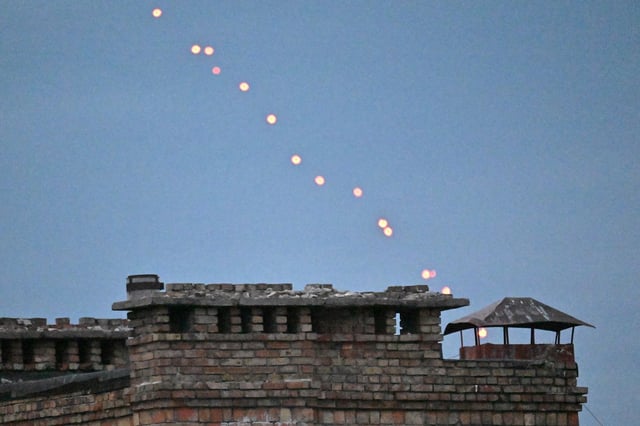 This photograph shows Ukrainian air defence firing projectiles at a Russian drone flying above Kyiv during an air attack on September 28, 2025, amid the Russian invasion of Ukraine. © Photo by SERGEI SUPINSKY/AFP via Getty Images