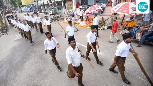 Patna: Volunteers of the Rashtriya Swayamsevak Sangh (RSS) take part in a Path Sanchalan (route march), the centenary year of RSS, ahead of the Vijayadashami festival, in Patna on Sunday. (ANI Photo)