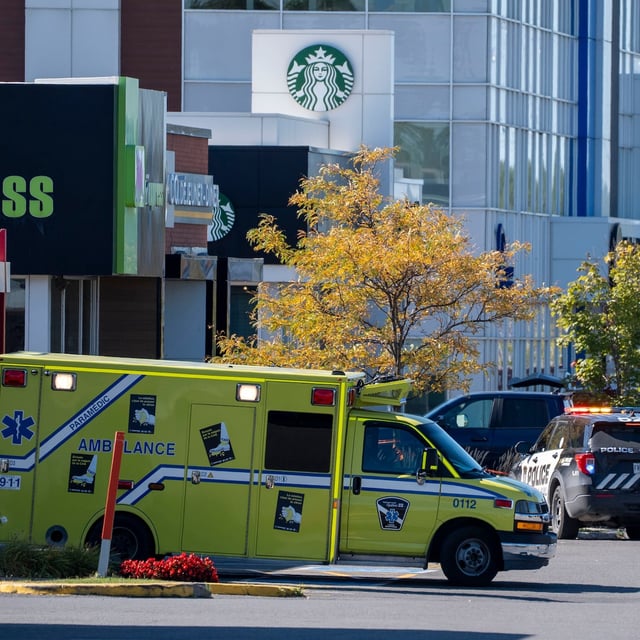 Police and paramedics respond to a shooting in Laval, Que., on Wednesday, Oct. 1, 2025. THE CANADIAN PRESS/Christinne Muschi