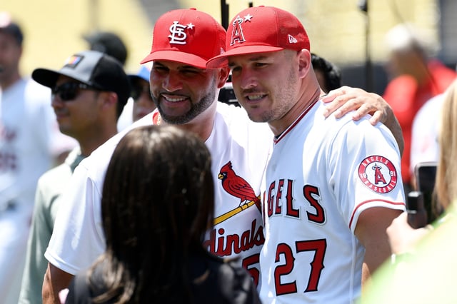 LOS ANGELES, CALIFORNIA - JULY 18: National League All-Star Albert Pujols #5 of the St. Louis Cardinals talks with American League All-Star Mike Trout #27 of the Los Angeles Angels during the 2022 Gatorade All-Star Workout Day at Dodger Stadium on July 18, 2022 in Los Angeles, California. (Photo by Kevork Djansezian/Getty Images)