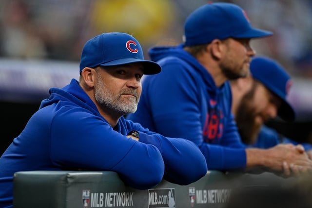 DENVER, CO - SEPTEMBER 12: David Ross #3 of the Chicago Cubs looks on from the dugout the first inning against the Colorado Rockies at Coors Field on September 12, 2023 in Denver, Colorado. (Photo by Dustin Bradford/Getty Images)