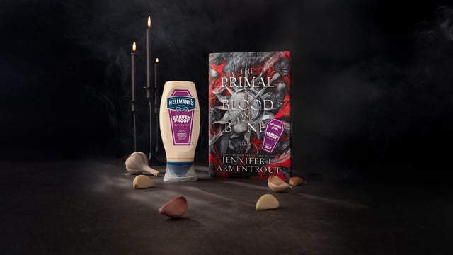 Jennifer Armentrout's book beside Hellmann's Garlic Aioli