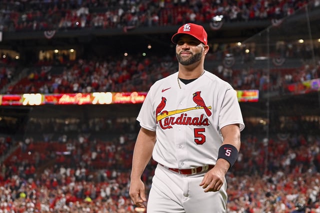 Sep 30, 2022; St. Louis, Missouri, USA;  St. Louis Cardinals designated hitter Albert Pujols (5) walks out the for a ceremony celebrating his 700th career home run before a game against the Pittsburgh Pirates at Busch Stadium. Mandatory Credit: Jeff Curry-USA TODAY Sports/ File Photo