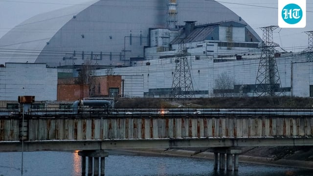 A general view shows the New Safe Confinement (NSC) structure over the old sarcophagus covering the damaged fourth reactor at the Chernobyl Nuclear Power Plant in Chernobyl.