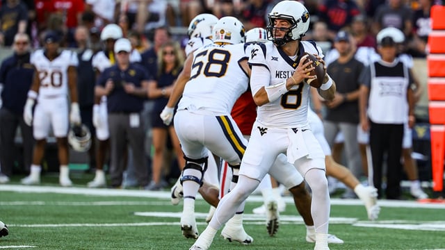 Oct 26, 2024; Tucson, Arizona, USA; West Virginia Mountaineers quarterback Nicco Marchiol (8) looks to throw the ball during the first quarter against the Arizona Wildcats at Arizona Stadium. Mandatory Credit: Aryanna Frank-Imagn Images