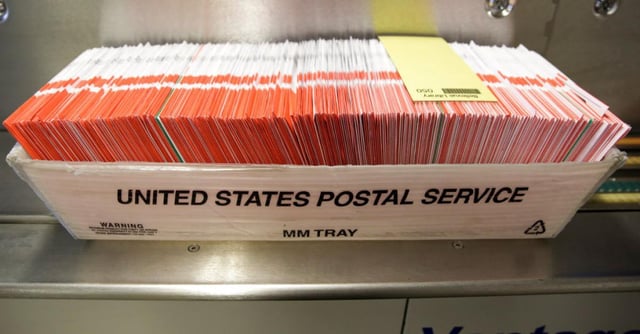 Mail-in ballots | (JASON REDMOND/Getty)