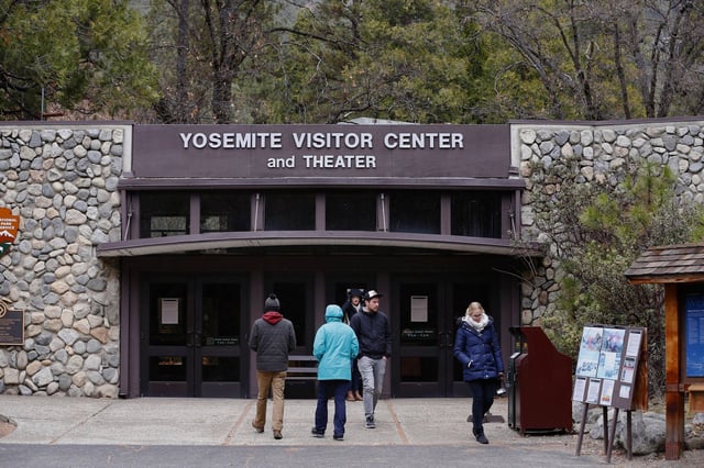 Visitors are turned away from the the closed Visitors Center in Yosemite National Park in January 2018, during a previous federal shutdown. Visitors centers at major national parks are likely to be closed during this year's shutdown as well.