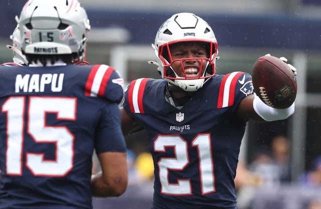 Foxboro, MA - New England Patriots safety Jaylinn Hawkins celebrates his interception during the first quarter of the game at Gillette Stadium. (Nancy Lane/Boston Herald)