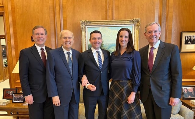 Derrick Porter, center, stands with his wife, Rebecca Porter, after accepting the call in 2024 from President Russell M. Nelson, second from left, to serve with the Tabernacle Choir at Temple Square. Scott Barrick, left, was serving as the choir's general manager at the time. President Michael O. Leavitt, right, serves as the choir's president.