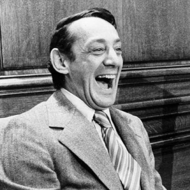 FILE - In this April 1977 file photo, San Francisco supervisor Harvey Milk sits in the mayor's office during the signing of the city's gay rights bill in San Francisco. The Navy is naming a ship in honor of the late gay rights leader, who served in the Navy for four years before he began a career in San Francisco city government. Navy Secretary Ray Mabus announced the decision to name the ship, which is one of a new fleet of replenishment oilers that will be built in San Diego. (AP Photo/File)